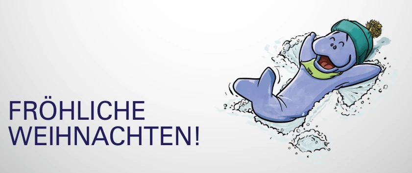 Zeichnung: Seekuh-Maskottchen Vera mit Mütze liegt im Schnee, daneben der Gruß „Fröhliche Weihnachten!“